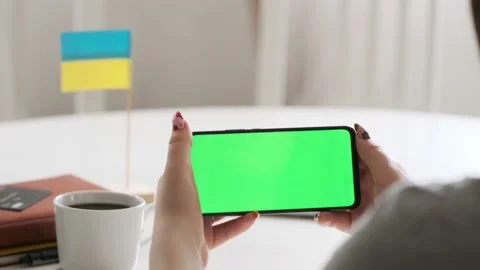 Use green screen for copy space closeup. Chroma key mock-up on smartphone in Stock Footage 197141156