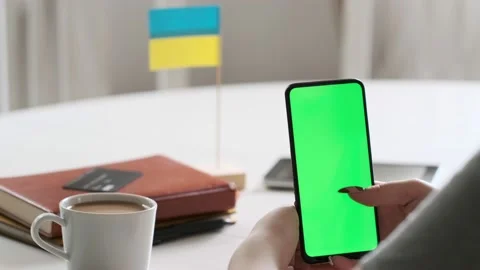 Use green screen for copy space closeup. Chroma key mock-up on smartphone in Stock Footage 197391809