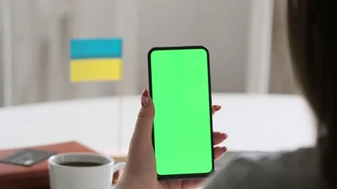 Use green screen for copy space closeup. Chroma key mock-up on smartphone in Stock Footage 197658984
