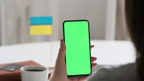 Use green screen for copy space closeup. Chroma key mock-up on smartphone in Stock Footage 201642528
