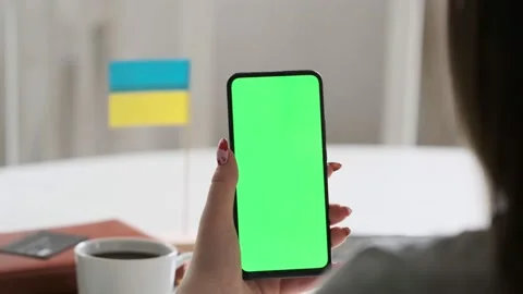 Use green screen for copy space closeup. Chroma key mock-up on smartphone in Stock Footage 202203201