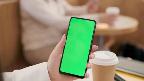 Use green screen for copy space closeup. Chroma key mock-up on smartphone in Video stock 212244255