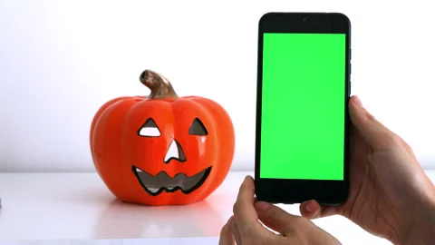 Use green screen for copy space close up. Chroma key mock-up on smartphone in ha Stock Footage 219791487