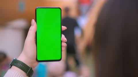 Use green screen for copy space closeup. Chroma key mock-up on smartphone in Video stock 236456906