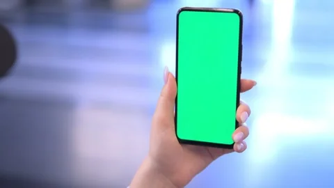 Use green screen for copy space closeup. Chroma key mock-up on smartphone in Stock Footage 249189920