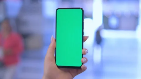 Use green screen for copy space closeup. Chroma key mock-up on smartphone in Stock Footage 249257323