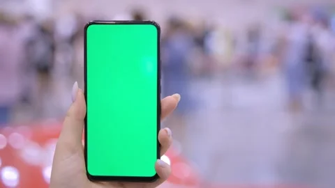 Use green screen for copy space closeup. Chroma key mock-up on smartphone in Stock-Footage 249257455