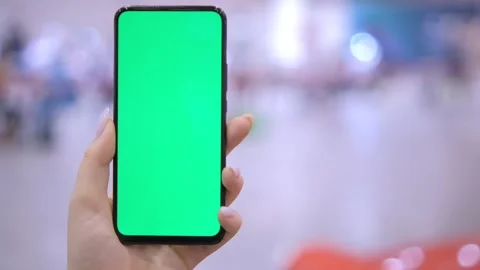 Use green screen for copy space closeup. Chroma key mock-up on smartphone in Stock Footage 255714857