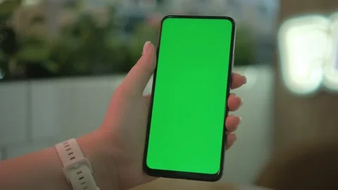 Use green screen for copy space closeup. Chroma key mock-up on smartphone in Stock Footage 263898082