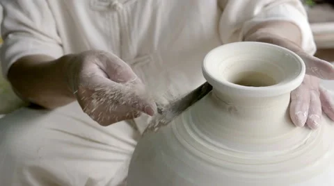 Use a knife handmade ceramics, shaping a ceramics Stock Footage 66064232