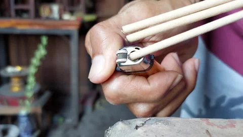 Use a lighter to light incense Stock-Footage 270017248