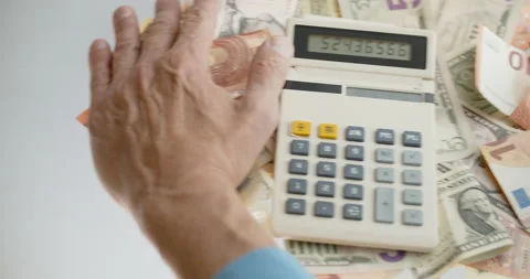 Use mobile banking instead of ancient calculator. Let money work for you. Stock Footage 132284167