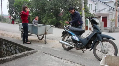 Use moto pull hook, took his wife and son outing Stock Footage 46458074