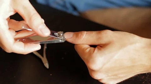Use nail clipper cut the nails, short for good hygiene. cut off fingernails. cut Stock Footage 81729782