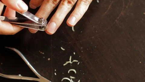 Use nail clipper cut the nails, short for good hygiene. cut off fingernails. cut Stock-Footage 82265043