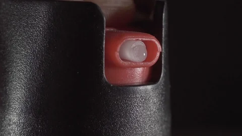 Use of pepper spray close up macro Stock Footage 121539920