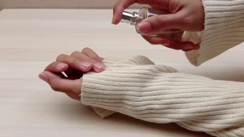 Use perfume spray on hand Stock Footage 139429842