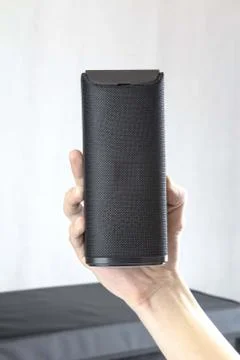 Use portable Bluetooth wireless speaker for music listening. Stock Photos