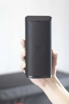 Use portable Bluetooth wireless speaker for music listening. Stock Photos