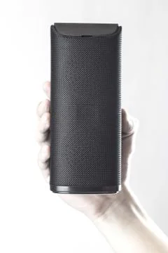Use portable Bluetooth wireless speaker for music listening. Stock Photos