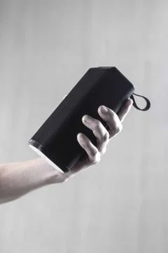 Use portable Bluetooth wireless speaker for music listening. Stock Photos