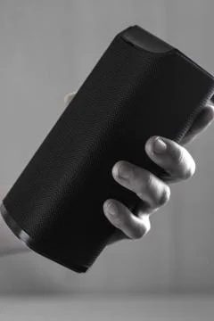 Use portable Bluetooth wireless speaker for music listening. Stock Photos