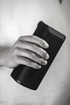 Use portable Bluetooth wireless speaker for music listening. Stock Photos