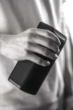 Use portable Bluetooth wireless speaker for music listening. Stock Photos