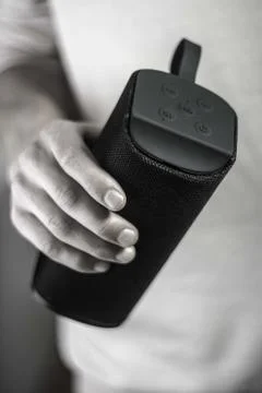 Use portable Bluetooth wireless speaker for music listening. Stock Photos
