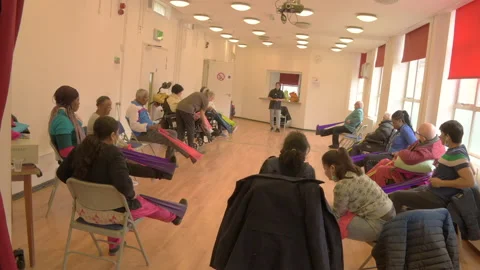 The use of resistance bands to add simple routines to stroke survivors Stock Footage 236772688