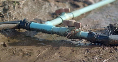 Use rubber bands to tie the joints between the hoses.There is water leaking. Stock Footage 317756743