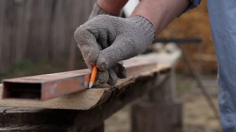 Use a ruler to measure the distance in a carpentry workshop Stock Footage 129411072