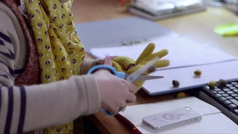 Use scissors to cut the gloves Stock Footage 261642549