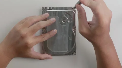 Use a screwdriver to unscrew each nut to open the HDD cover to inspect and re Stock Footage 168519107