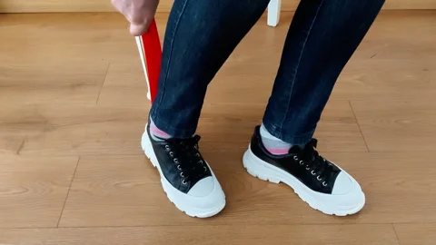 Use a Shoe Horn Correctly: Quick, Comfortable Shoe Wearing Made Easy 스톡 동영상 328003404