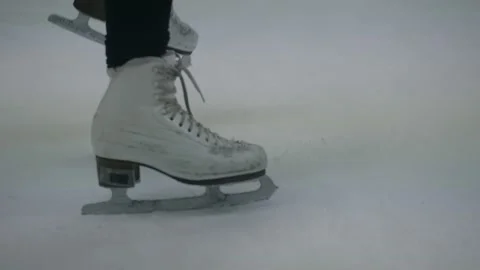 Use skates to brake on ice. Close-up Stock Footage 144506294