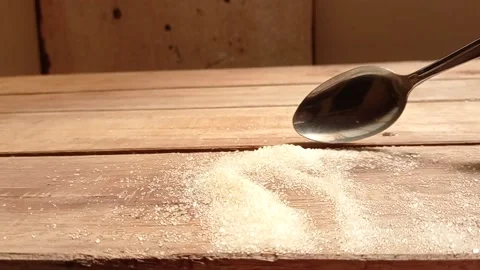 Use a spoon to drop the sugar Stock Footage 139430317