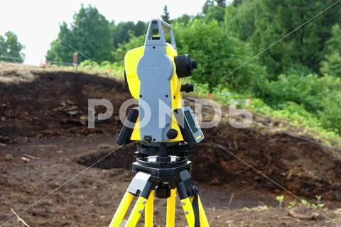 The use of a total station in the field in Siberia Stock Photos