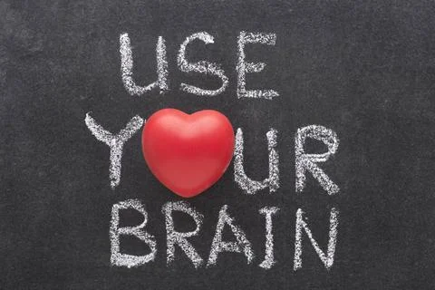 Use your brain use your brain phrase handwritten on chalkboard with heart ... 写真素材