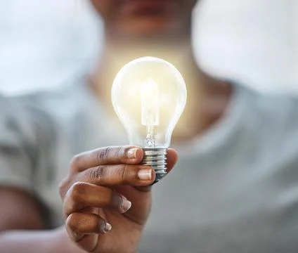 Use your knowledge to bring light to this world. an unrecognisable businesswoman Stock Photos