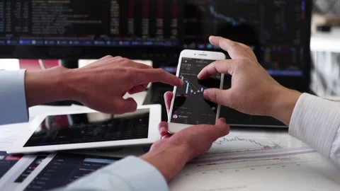 Use your mobile phone and computer to watch and invest in stocks Stock Footage 165791035