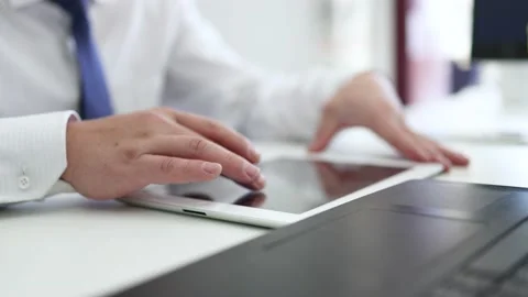 Use your tablet to watch and trade stocks Stock Footage 170592245