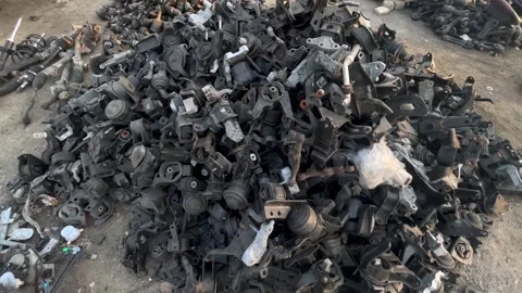 Used Automotive Mounting Brackets and Metal Support Components in Salvage Yard Stock Footage 346360520