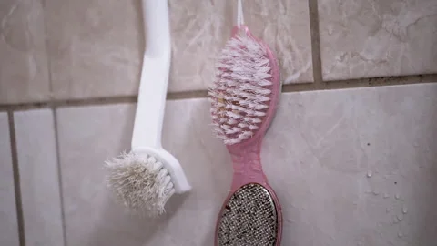 Used Bathroom Brushes Hanging Stock Footage 312008833