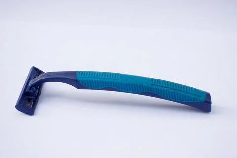 Used blue razor on a white background Stock Photos