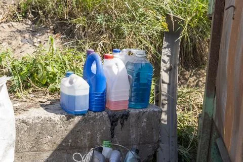Used cans with chemically active substances thrown in the trash 库存照片
