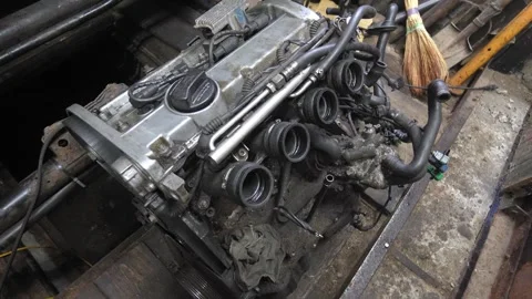 Used car engine preparing for installation in garage 스톡 동영상 304120146