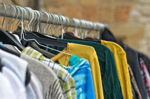Used cloting on a rail Stock Photos