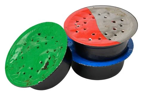 Used coffee capsule for coffee machine on a white background, plastic packagi Fotos de archivo