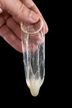 Used condom with sperm Stock Photos